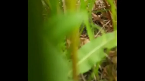 Naked horny MILF in a chamomile field masturbates, pisses and wards off a wasp / Angela-MILF